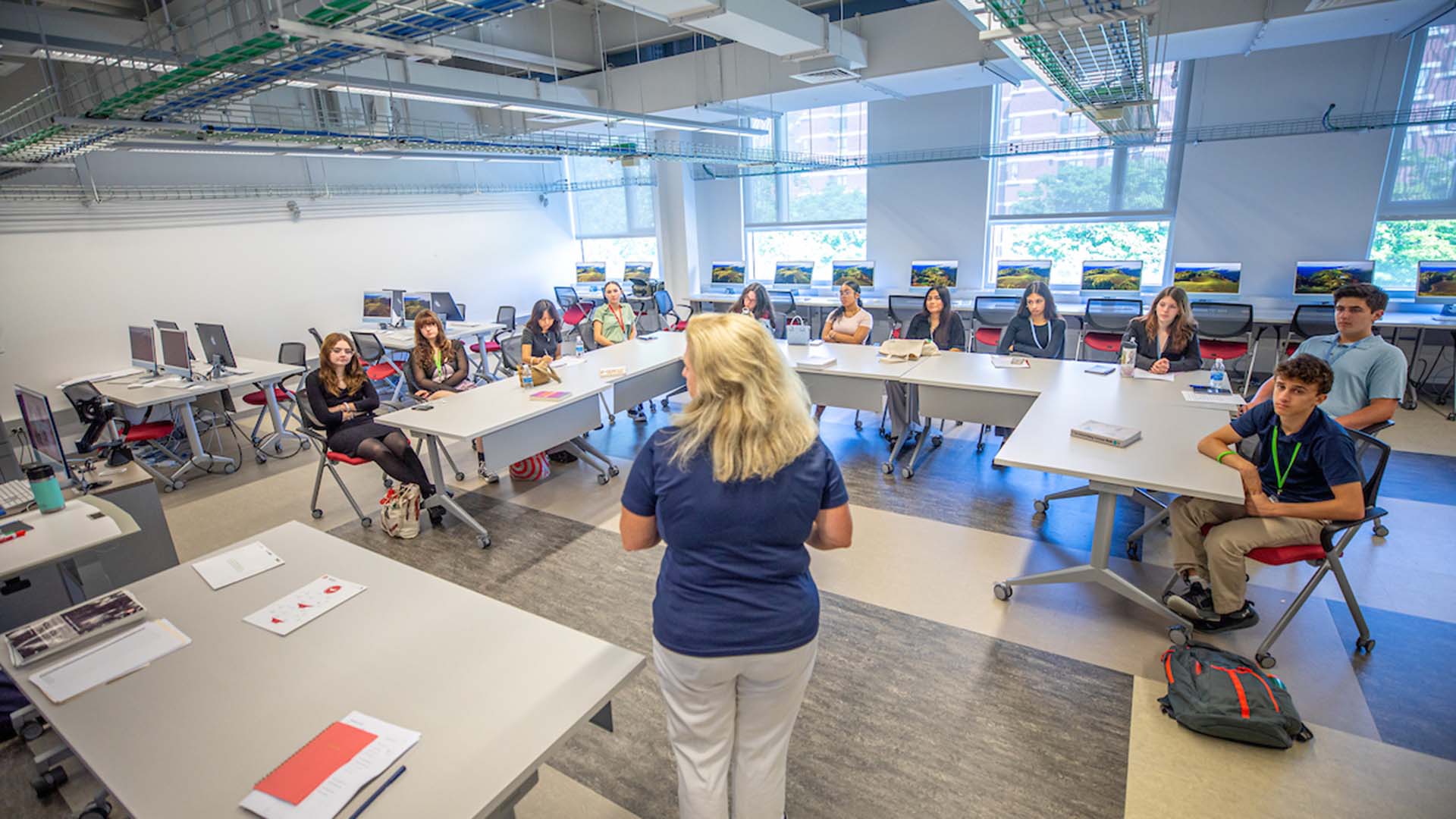 Students watch as a professor instructs them