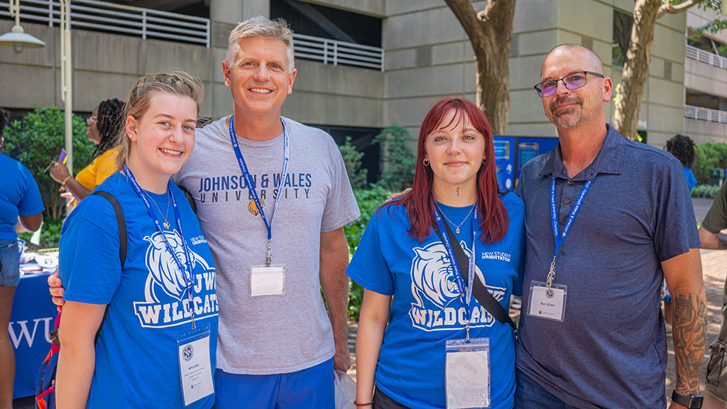 New students pose with their parents during New Student Orientation.