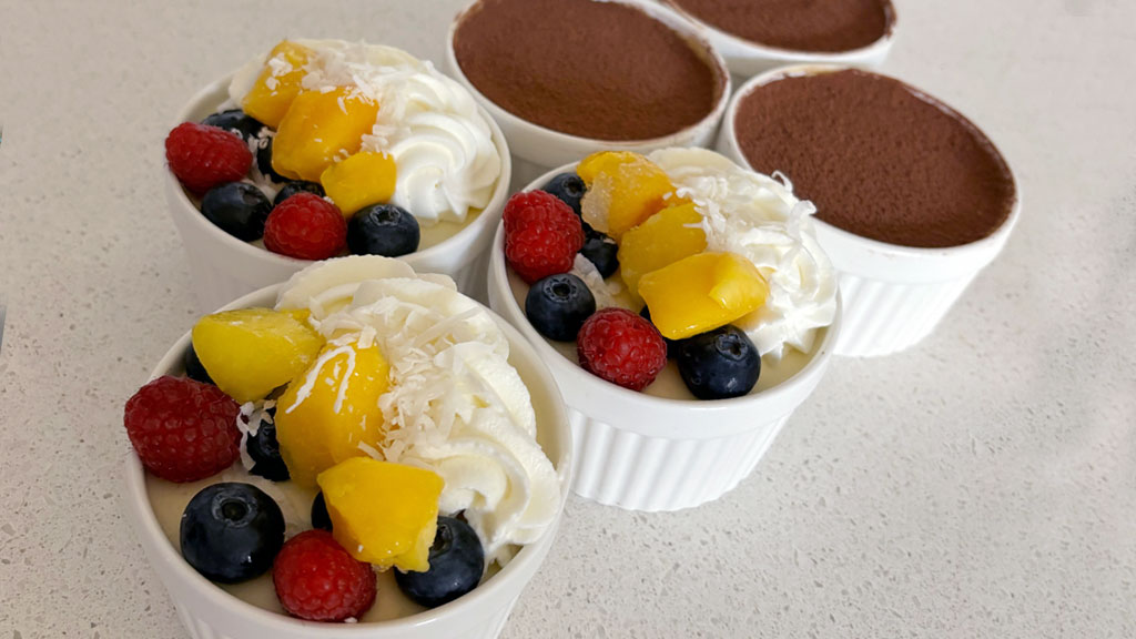 Tiramisu with fruit and a cocoa topping.