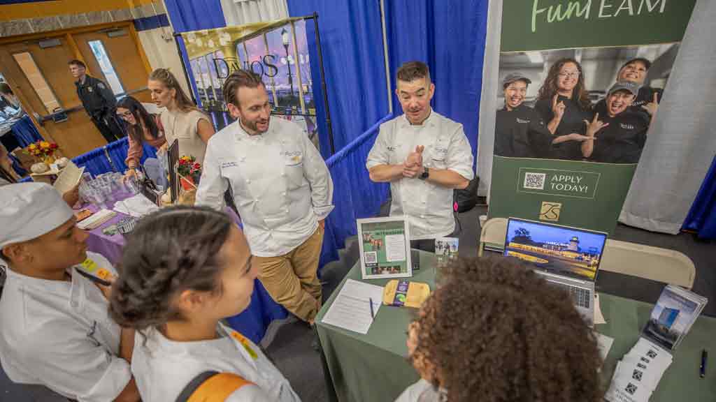 Students networking with industry representatives