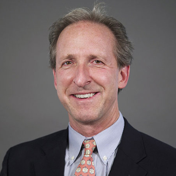 a headshot of College of Business Associate Professor Tim Howes