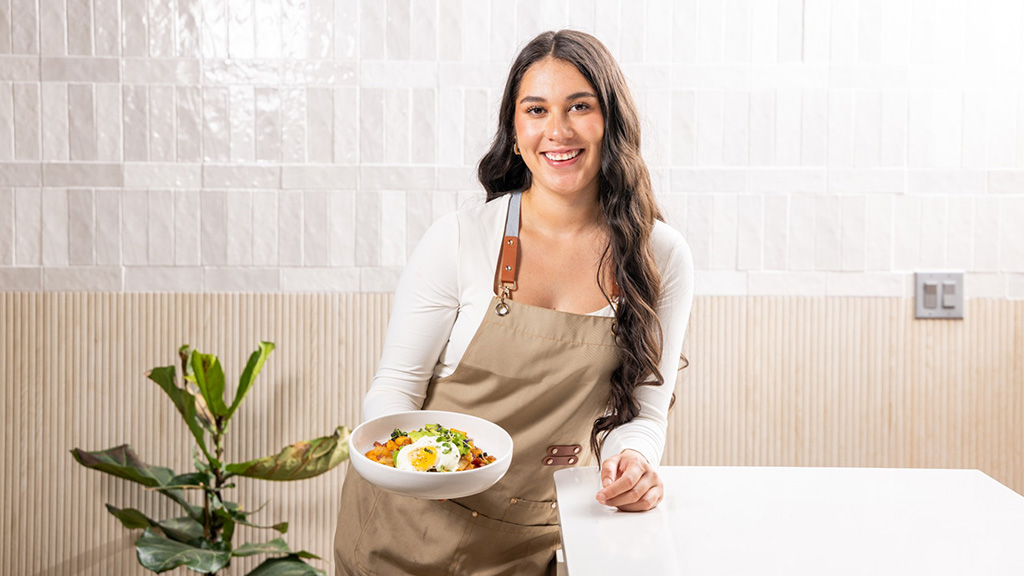 Charlotte student cooking her recipe for magazine