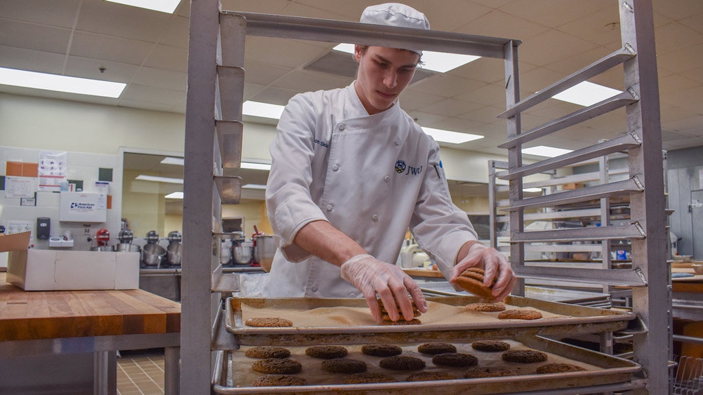 photo of Daron Sklar making and packaging cookies for charity