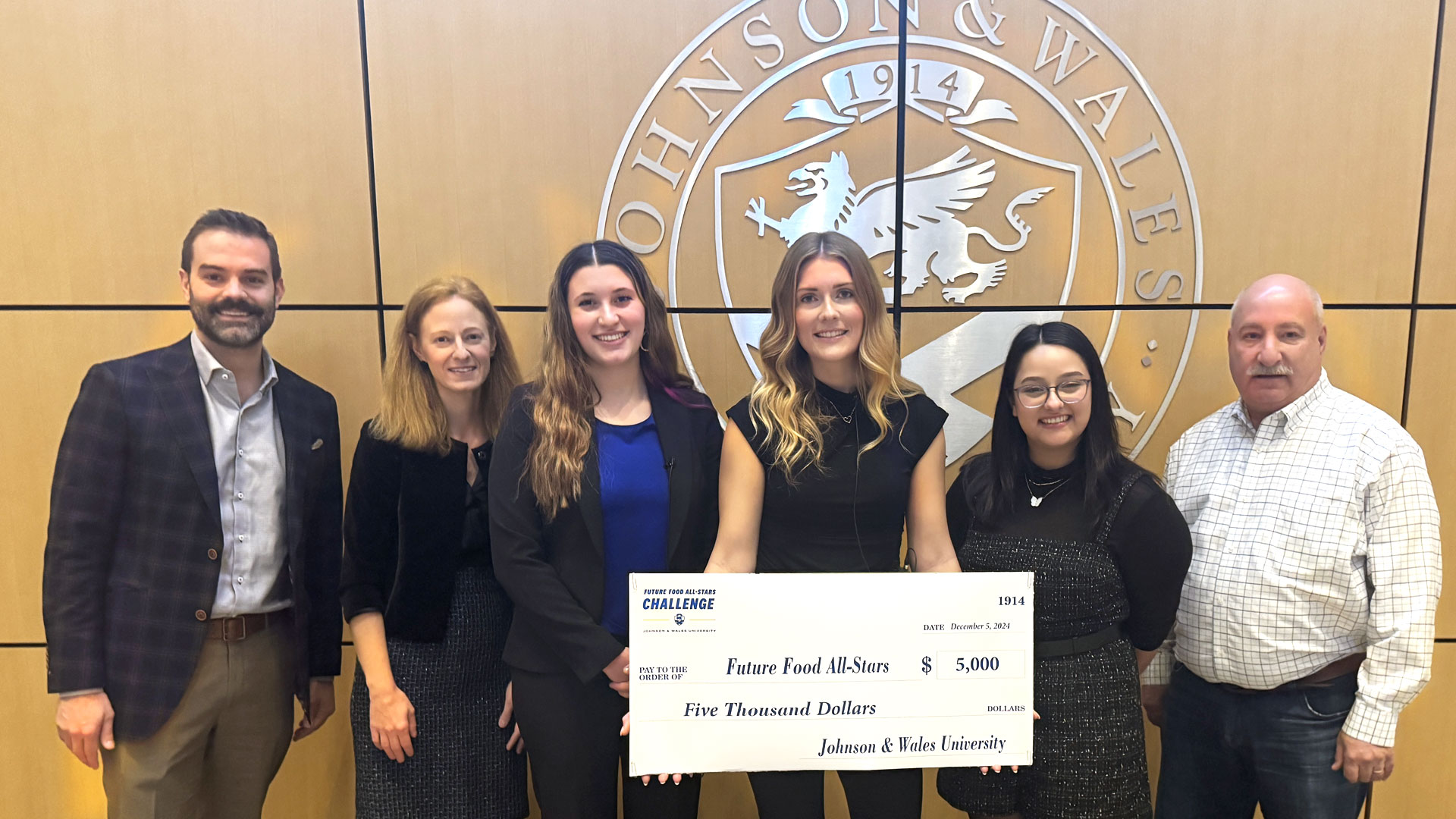 Charlotte Future Food All-Stars winners hold the ceremonial check.