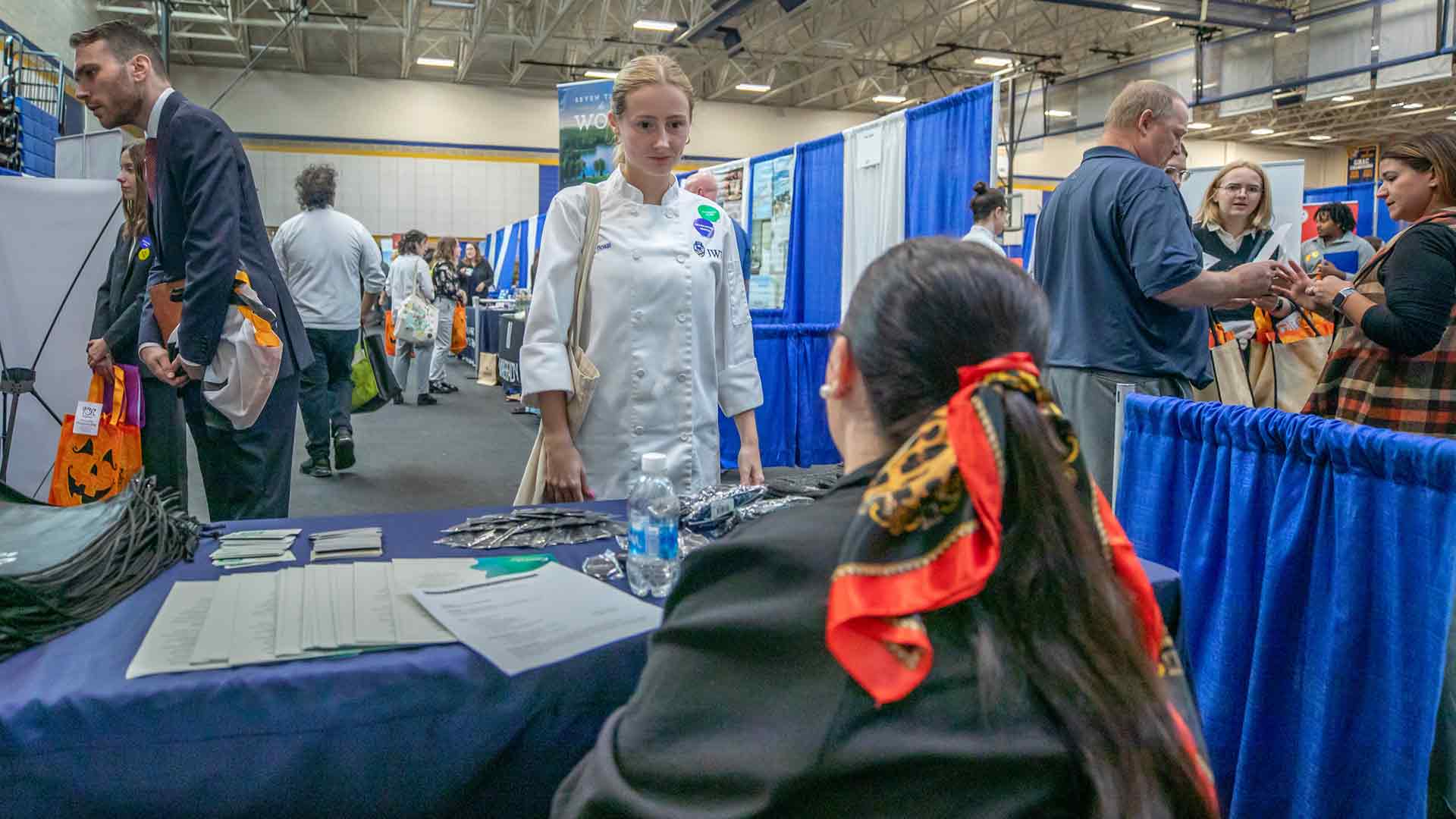 Student at Career Fair networking with employers.